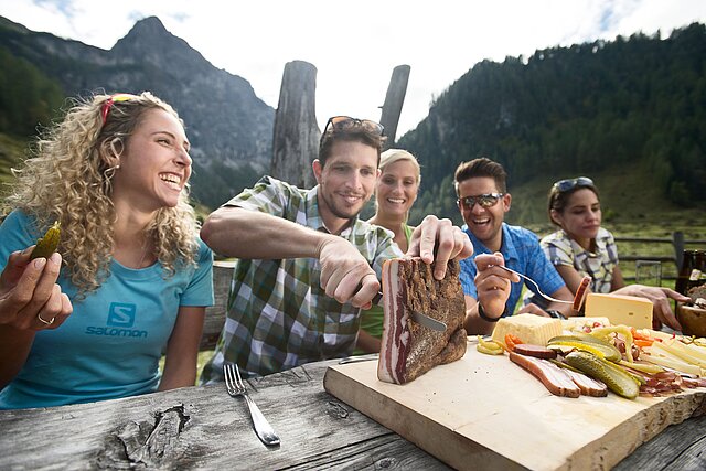 <p>Friends having a "Brettljause" on an alpine pasture.</p>