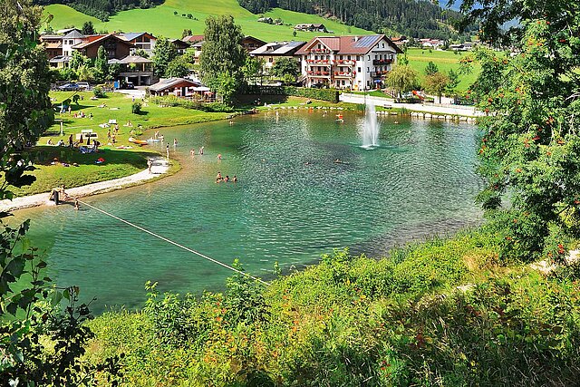 <p>Auszeit beim Badesee Reitdorf im Sommerurlaub in Flachau</p>